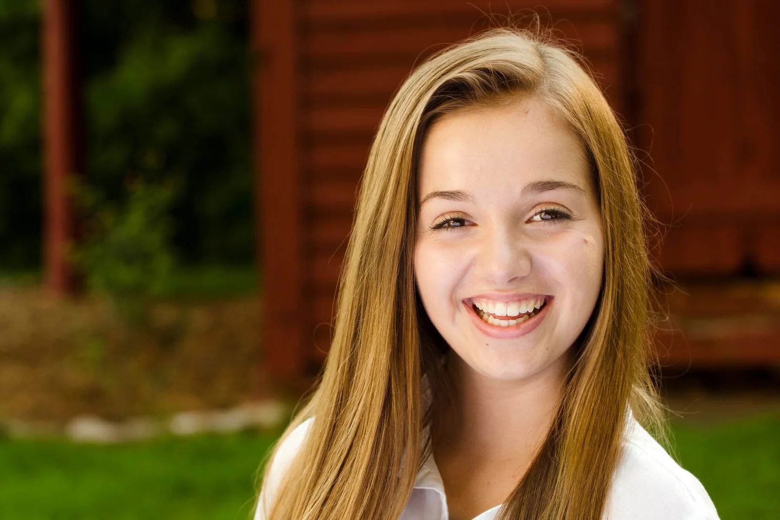 Teen smiling with braces during orthodontic treatment in Suffolk, VA